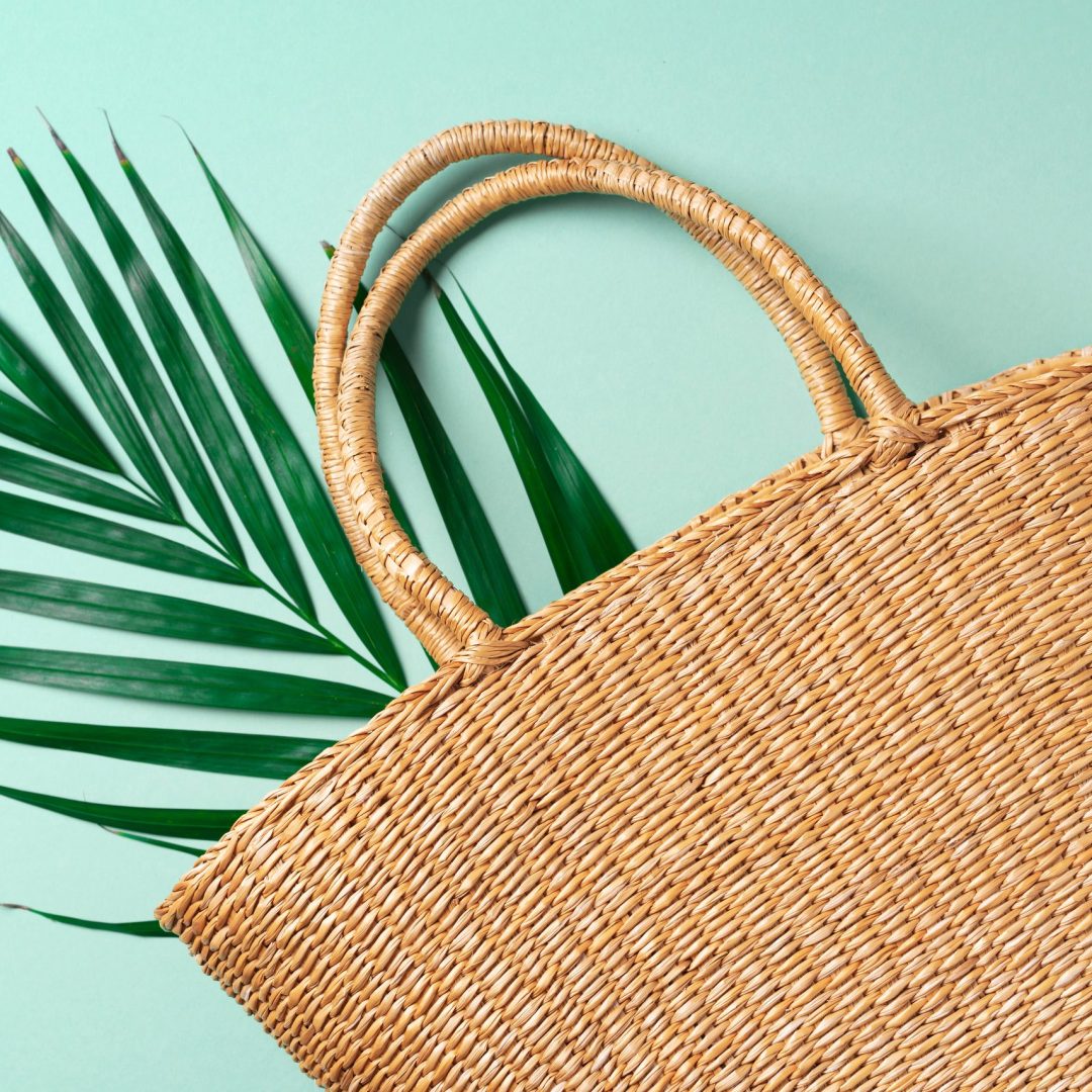 Handmade summer bag on trendy green background. Top view. Fashionable stylish accessory. Natural, organic, eco friendly, zero waste, plastic free concept